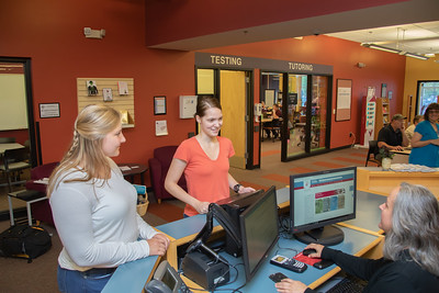 Students standing by learning common desk